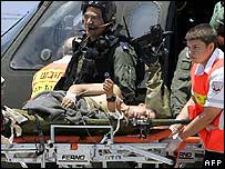Wounded solider being removed from helicopter