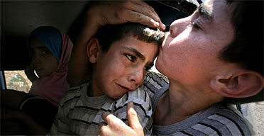 Children flee the village of Aitaroun in South Lebanon. Photograph: Sean Smith/Guardian