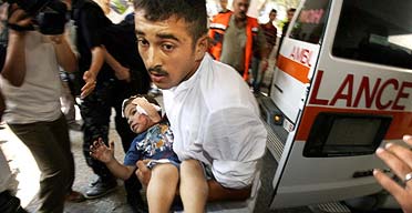 Palestinian girl injured in an Israeli air raid arriving at Shifa hospital